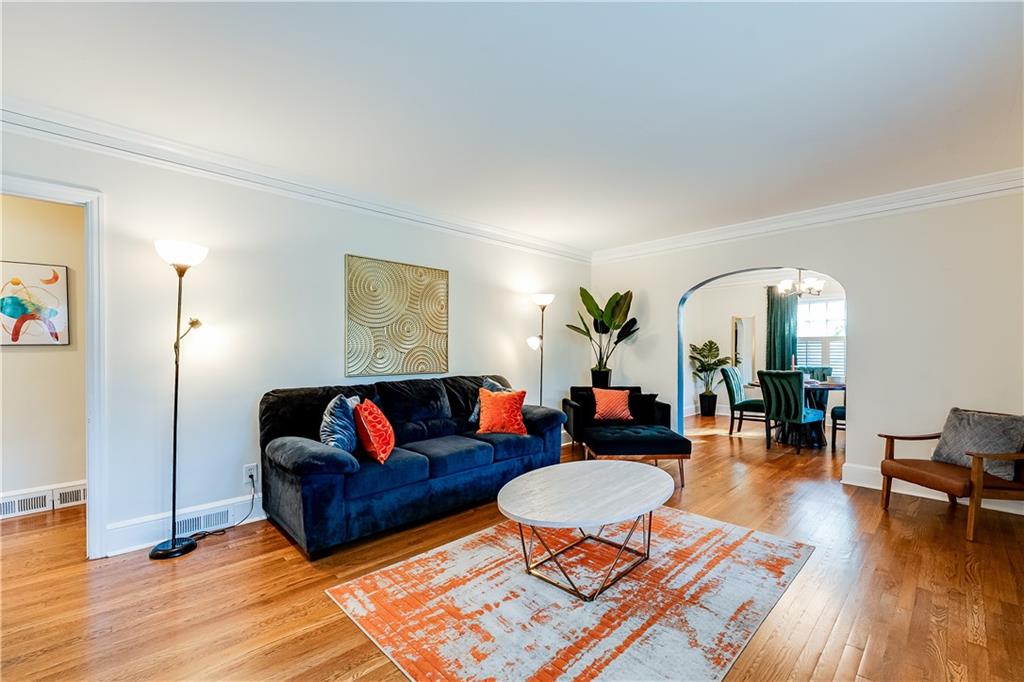 2083 West Rugby Avenue College Park, GA 30337 - Photo 7 of 49 a living room with furniture and wooden floor