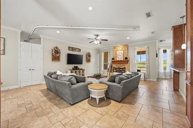 a living room with furniture and a flat screen tv