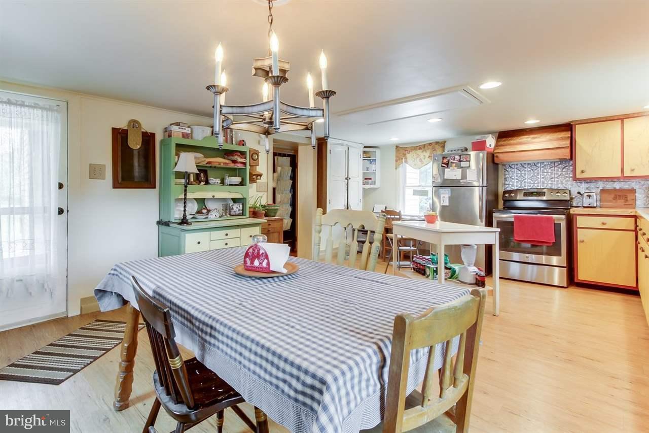 1745 Beck Mill Road Hanover, PA 17331 - Photo 12 of 25 a view of a dining room with furniture and wooden floor