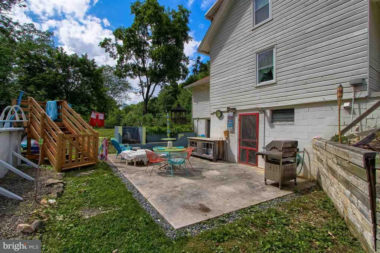 1745 Beck Mill Road Hanover, PA 17331 - Photo 20 of 25 a view of a backyard with a patio and fire pit