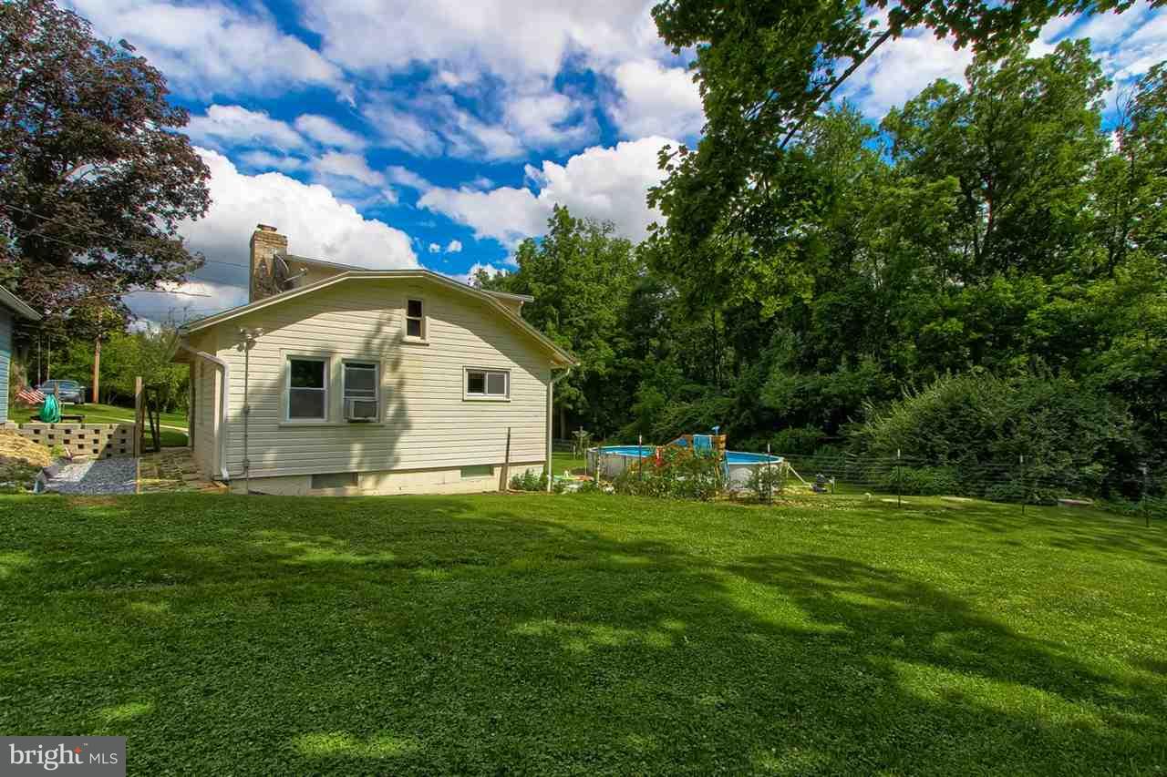1745 Beck Mill Road Hanover, PA 17331 - Photo 25 of 25 a big white house with a big yard and large trees