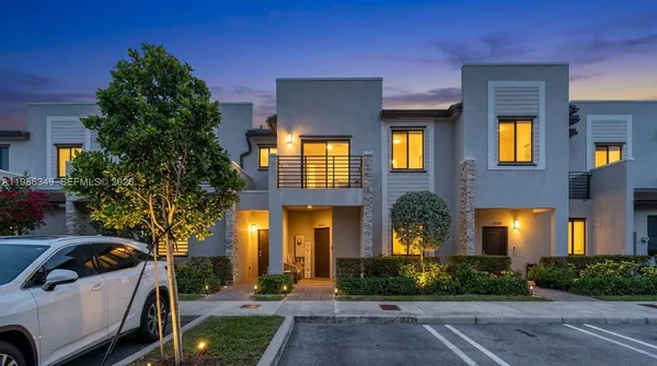 a view of multiple houses with a yard