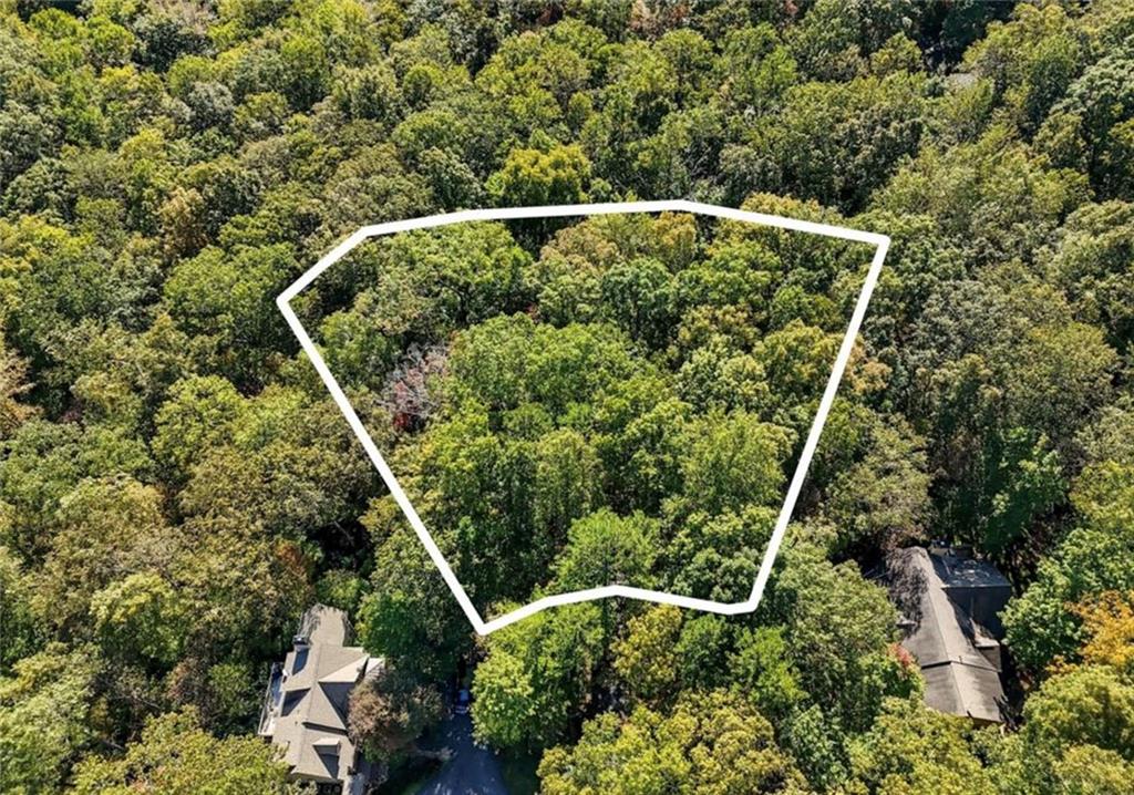a balcony with wooden floor and plants