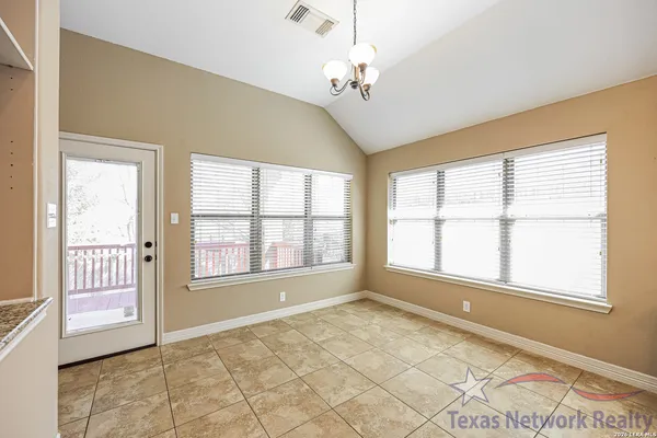 a view of an empty room with a window
