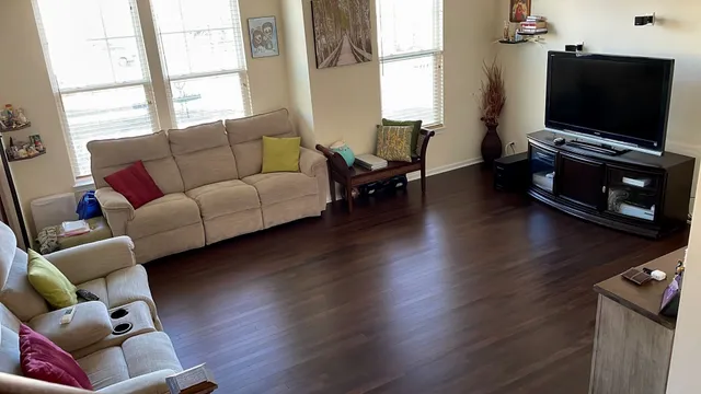 a living room with furniture and a flat screen tv