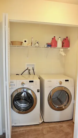 a utility room with dryer and washer