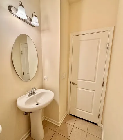 a bathroom with a sink a mirror and a shower