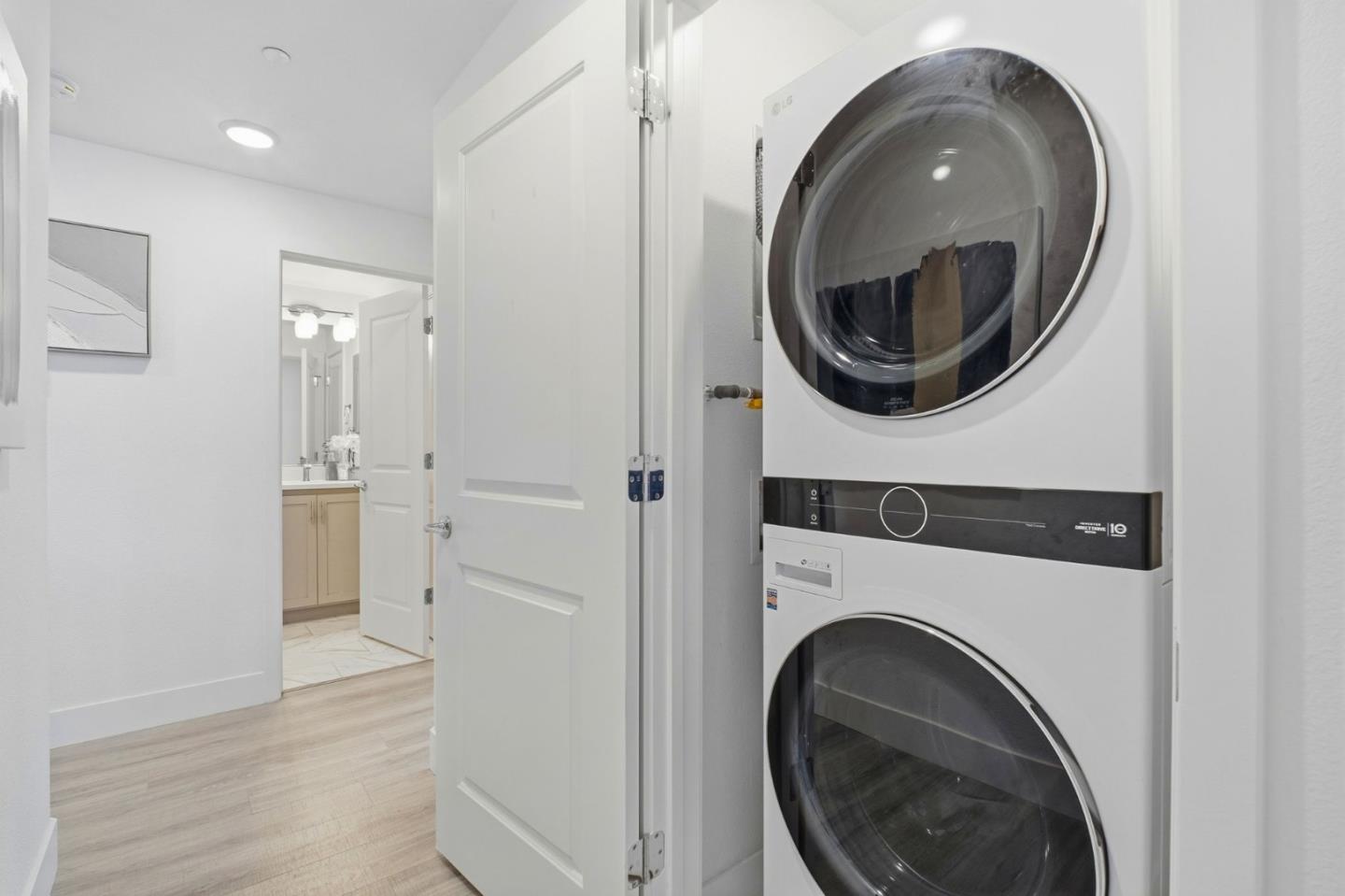 385 Line Street Hayward, CA 94544 - Photo 26 of 38 a view of a hallway with washer and dryer