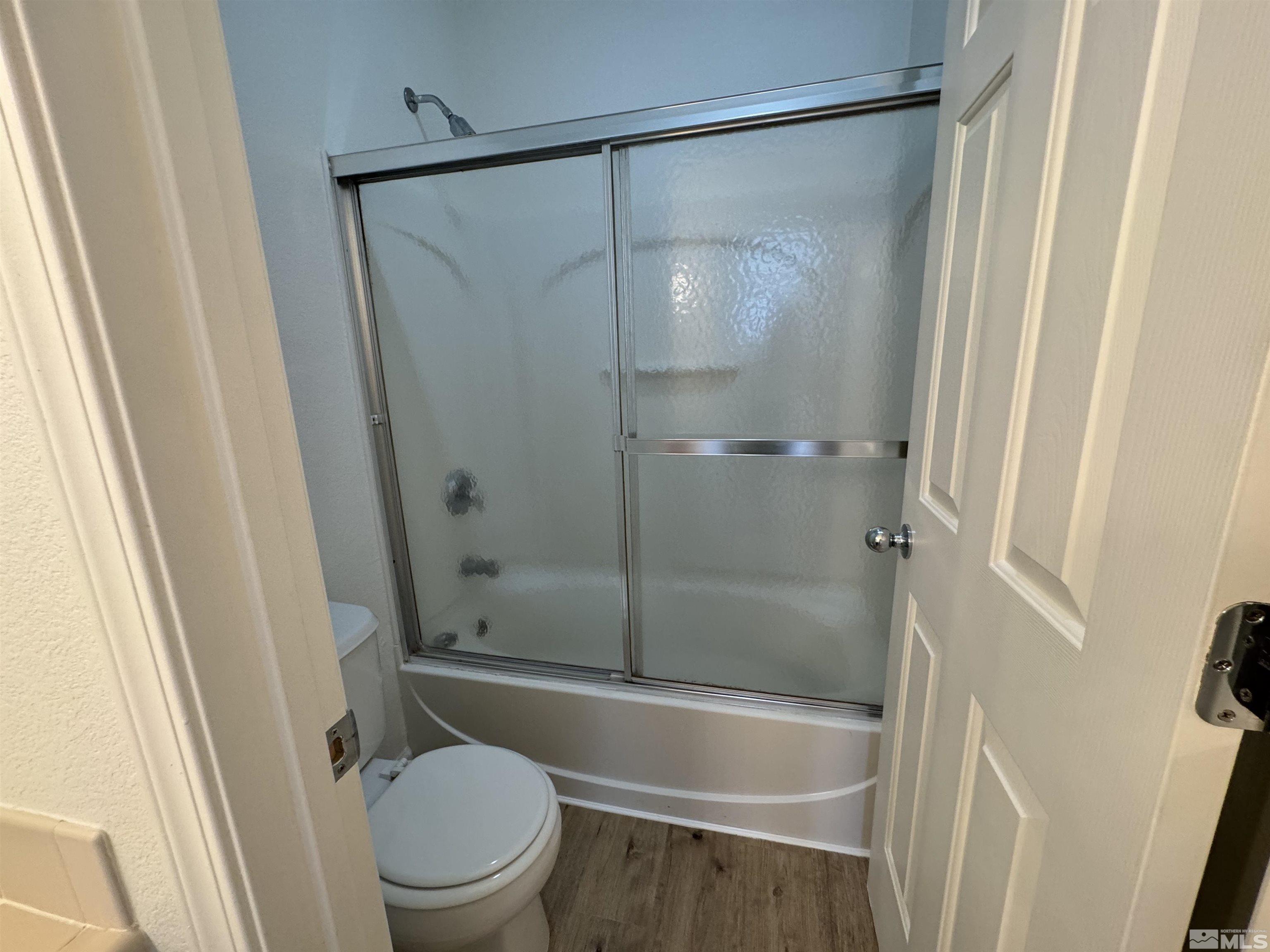 405 Sapphire Way Fallon, NV 89406 - Photo 15 of 30 a bathroom with a shower and a toilet