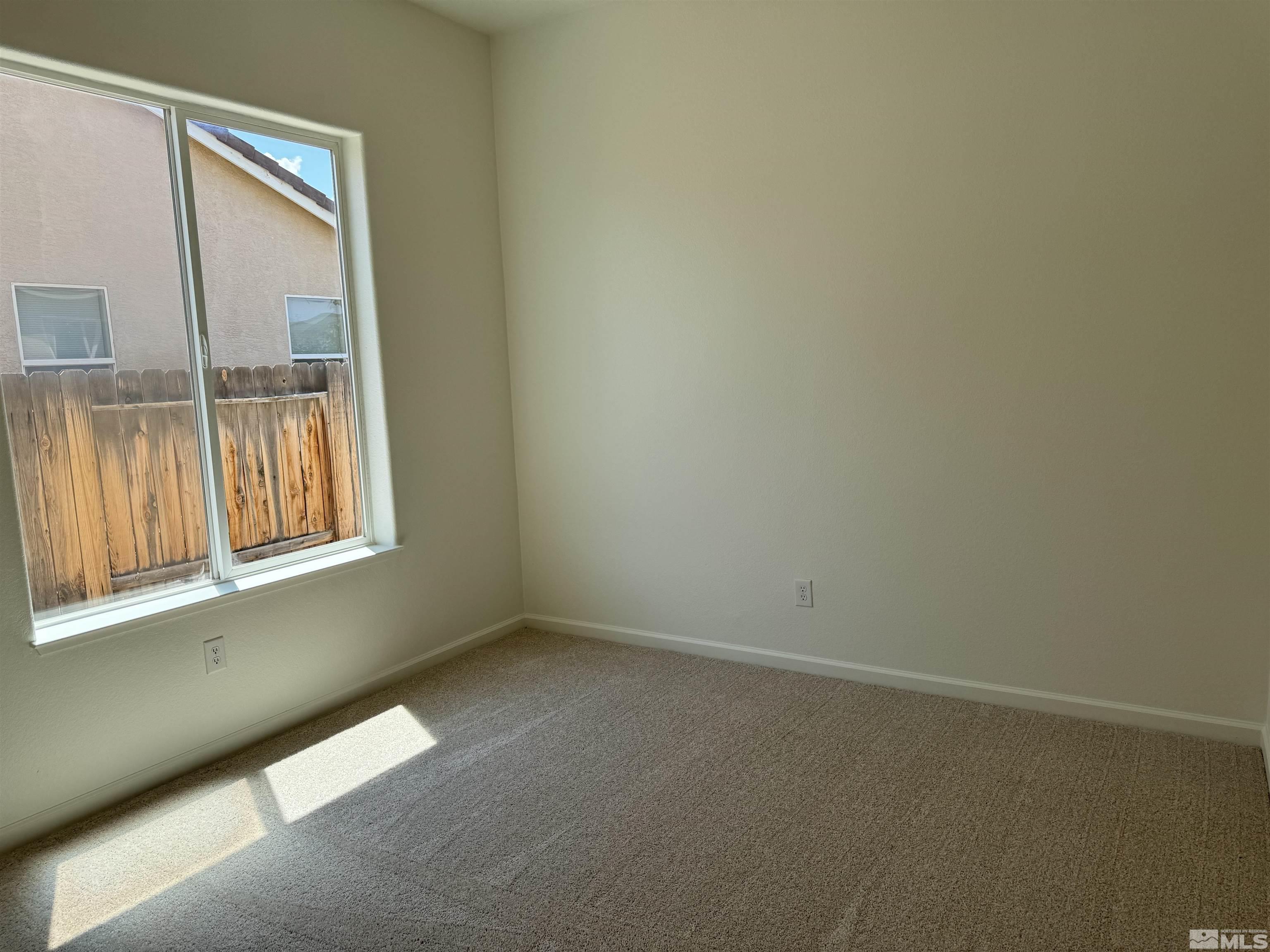 405 Sapphire Way Fallon, NV 89406 - Photo 18 of 30 an empty room with windows