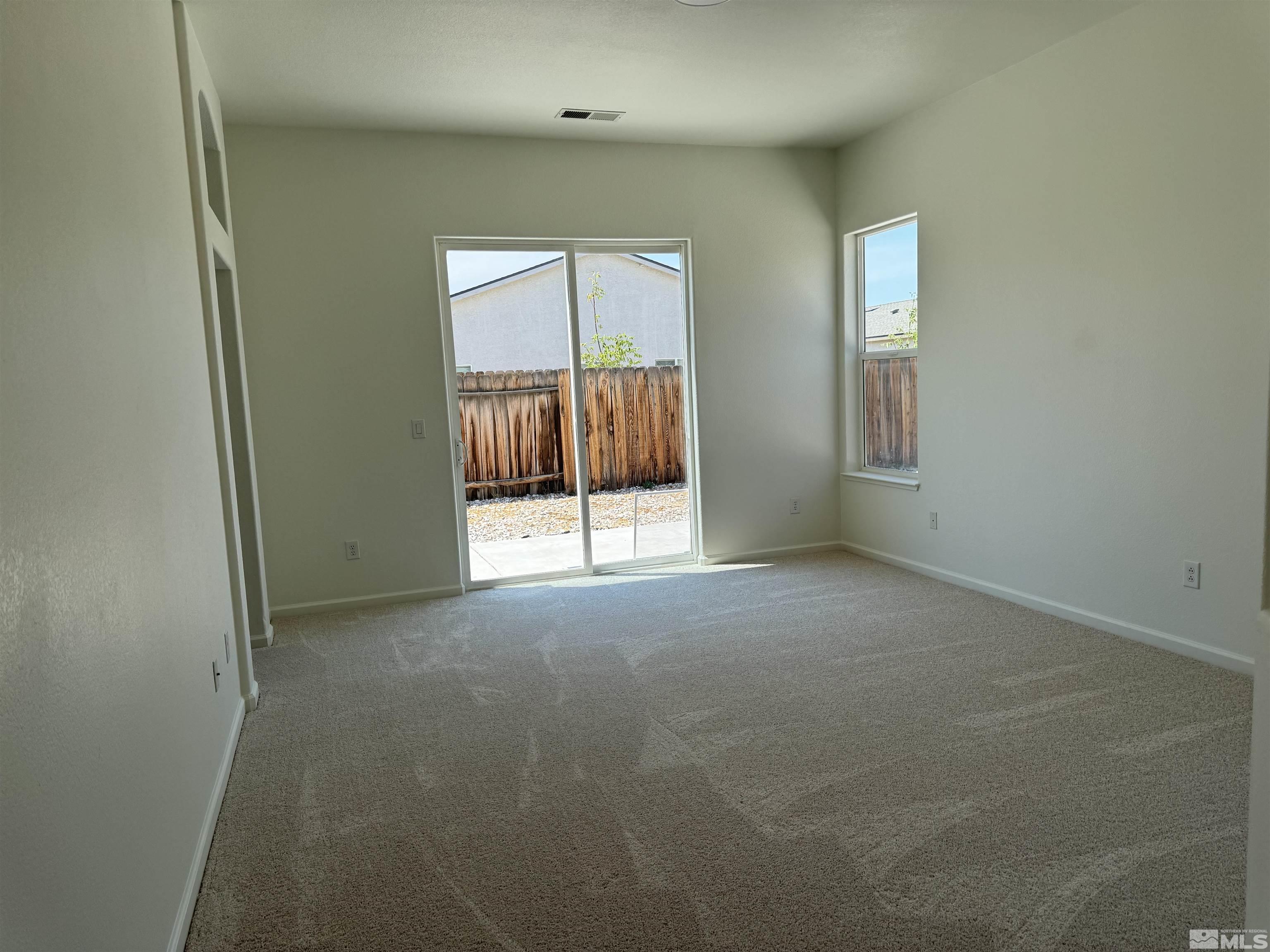 405 Sapphire Way Fallon, NV 89406 - Photo 24 of 30 an empty room with a fireplace