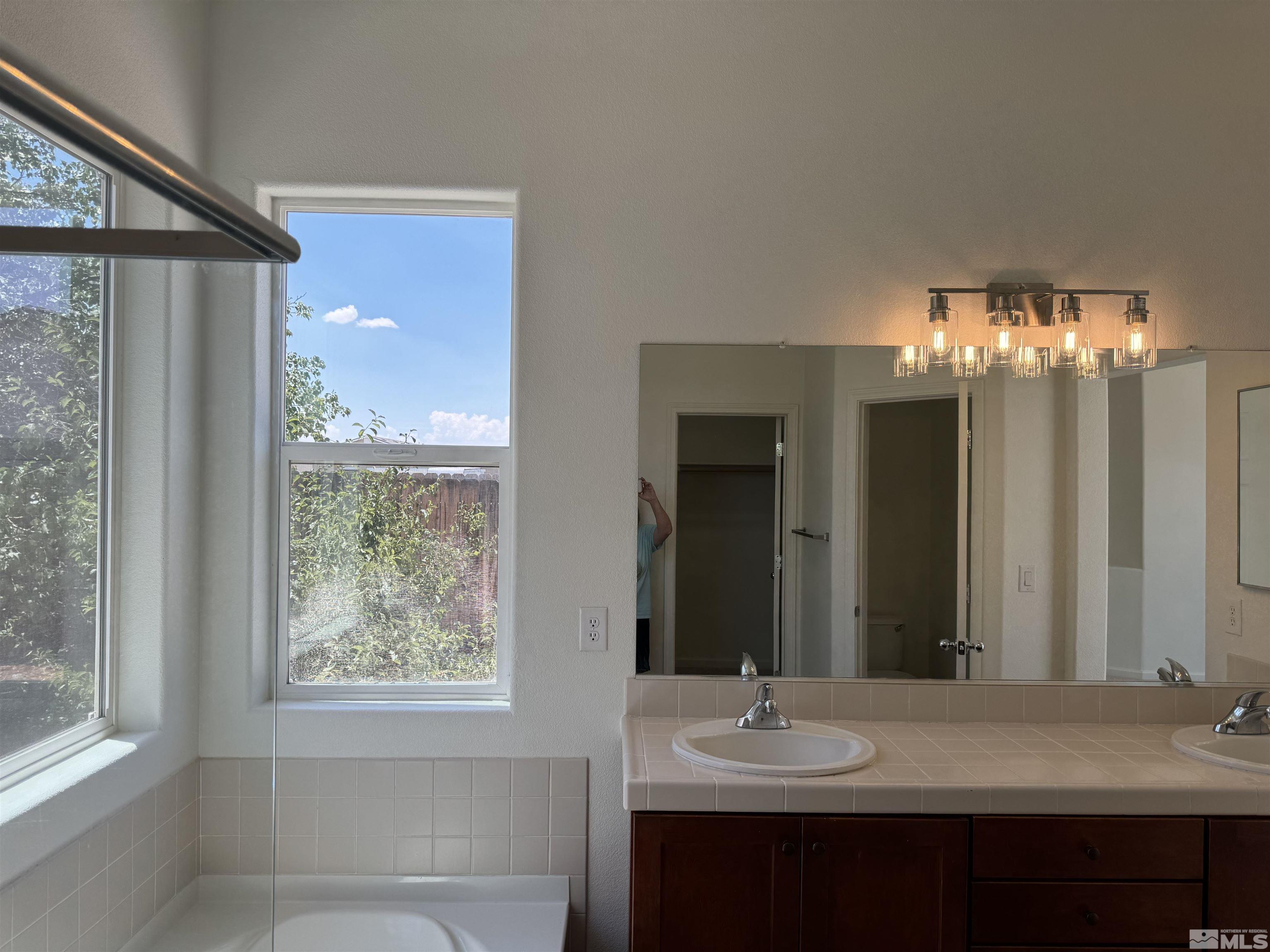 405 Sapphire Way Fallon, NV 89406 - Photo 26 of 30 a bathroom with a sink and a mirror