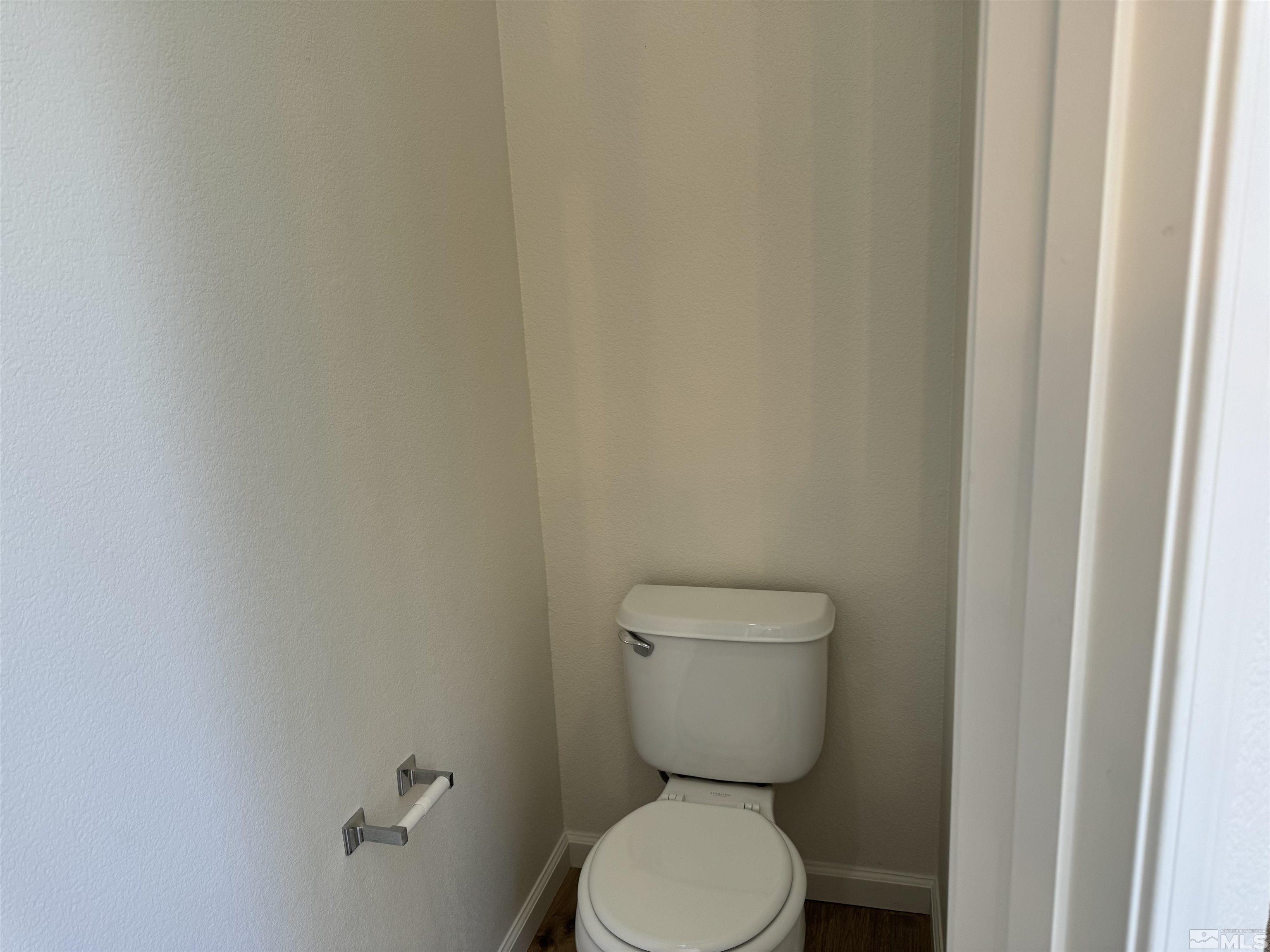 405 Sapphire Way Fallon, NV 89406 - Photo 28 of 30 a white toilet sitting next to a white wall