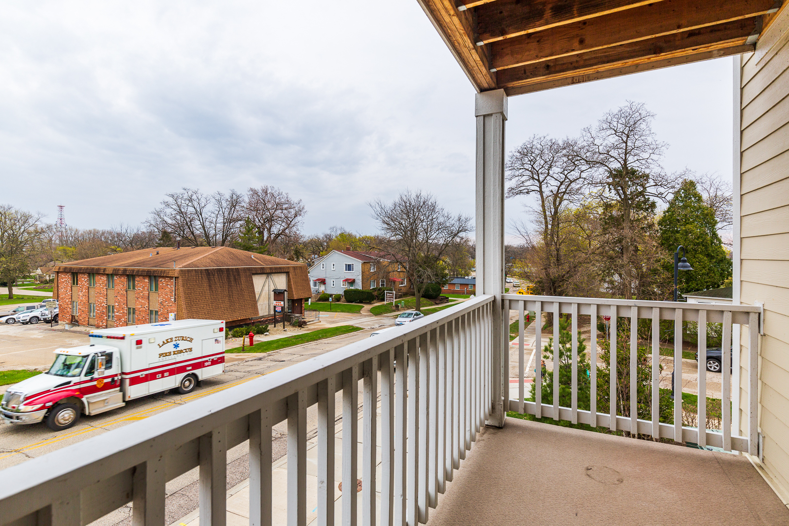60 West Main Street, Unit 333 Lake Zurich, IL 60047 - Photo 15 of 15 a balcony view with street view and car parked