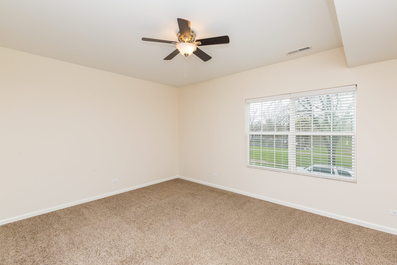 60 West Main Street, Unit 333 Lake Zurich, IL 60047 - Photo 7 of 15 an empty room with a window