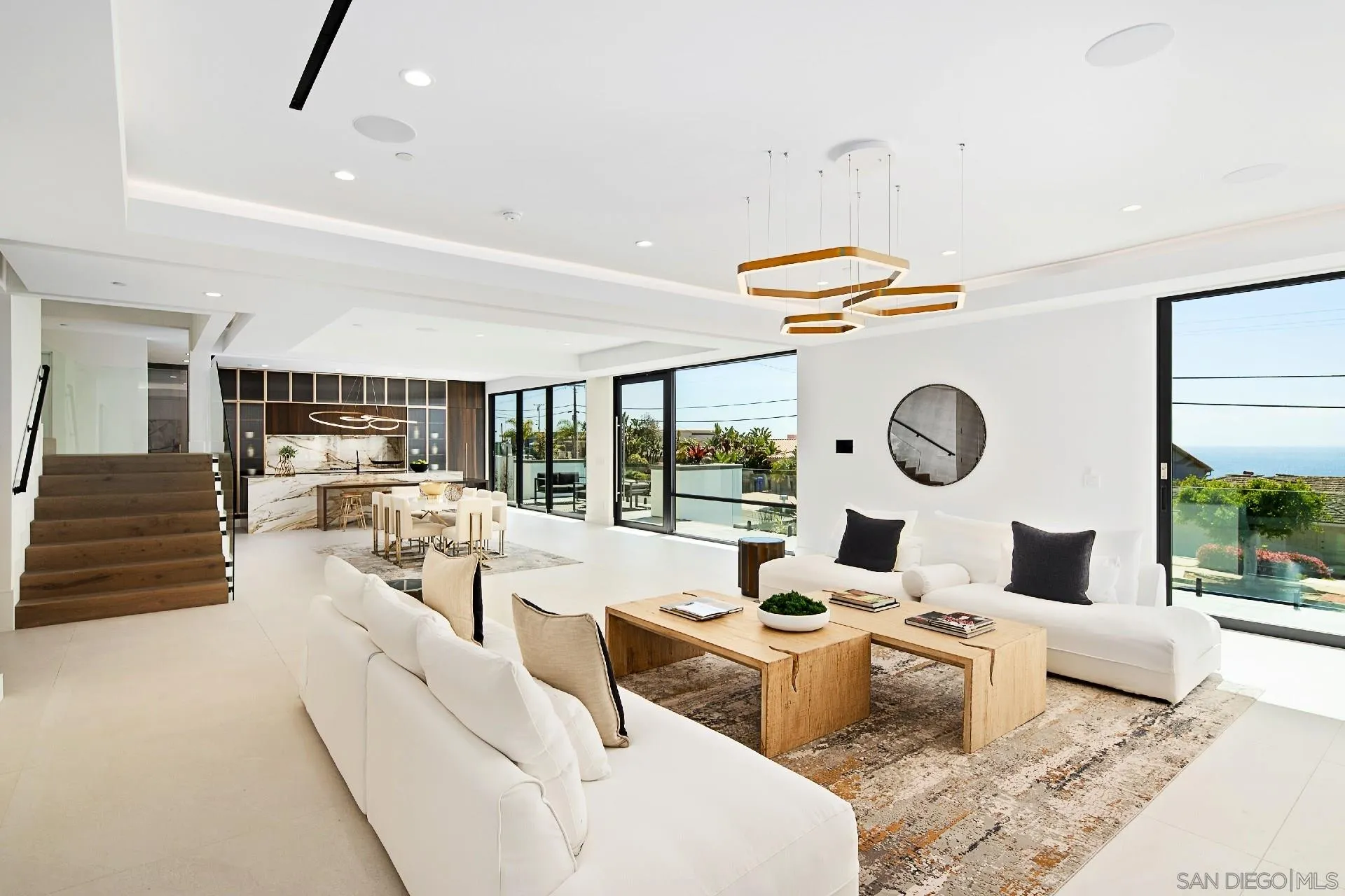 926 La Jolla Rancho Road La Jolla, CA 92037 - Photo 15 of 54 a living room with furniture and a large window
