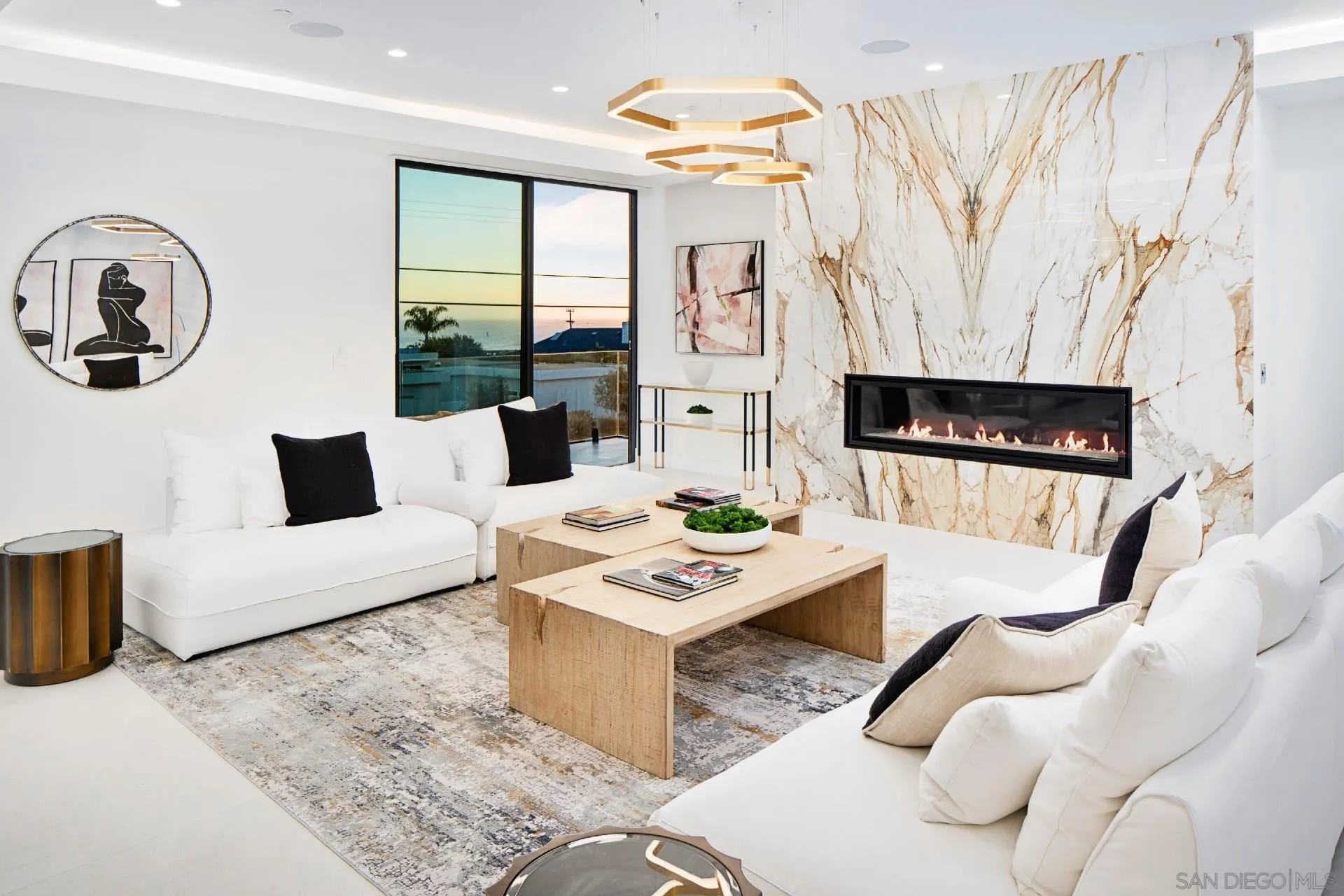 926 La Jolla Rancho Road La Jolla, CA 92037 - Photo 16 of 54 a living room with furniture and a fireplace