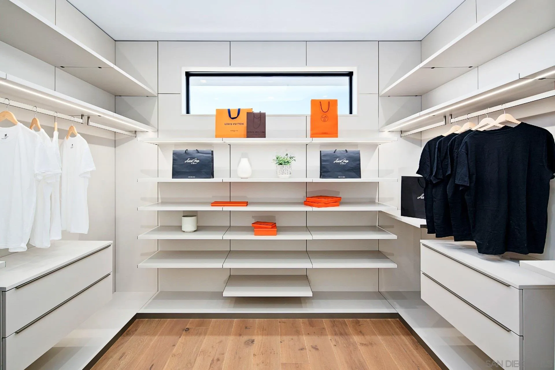 926 La Jolla Rancho Road La Jolla, CA 92037 - Photo 24 of 54 a view of walk in closet with clothes and shoes