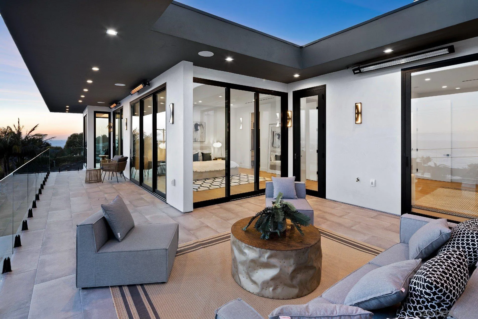 926 La Jolla Rancho Road La Jolla, CA 92037 - Photo 27 of 54 a living room with furniture and a floor to ceiling window