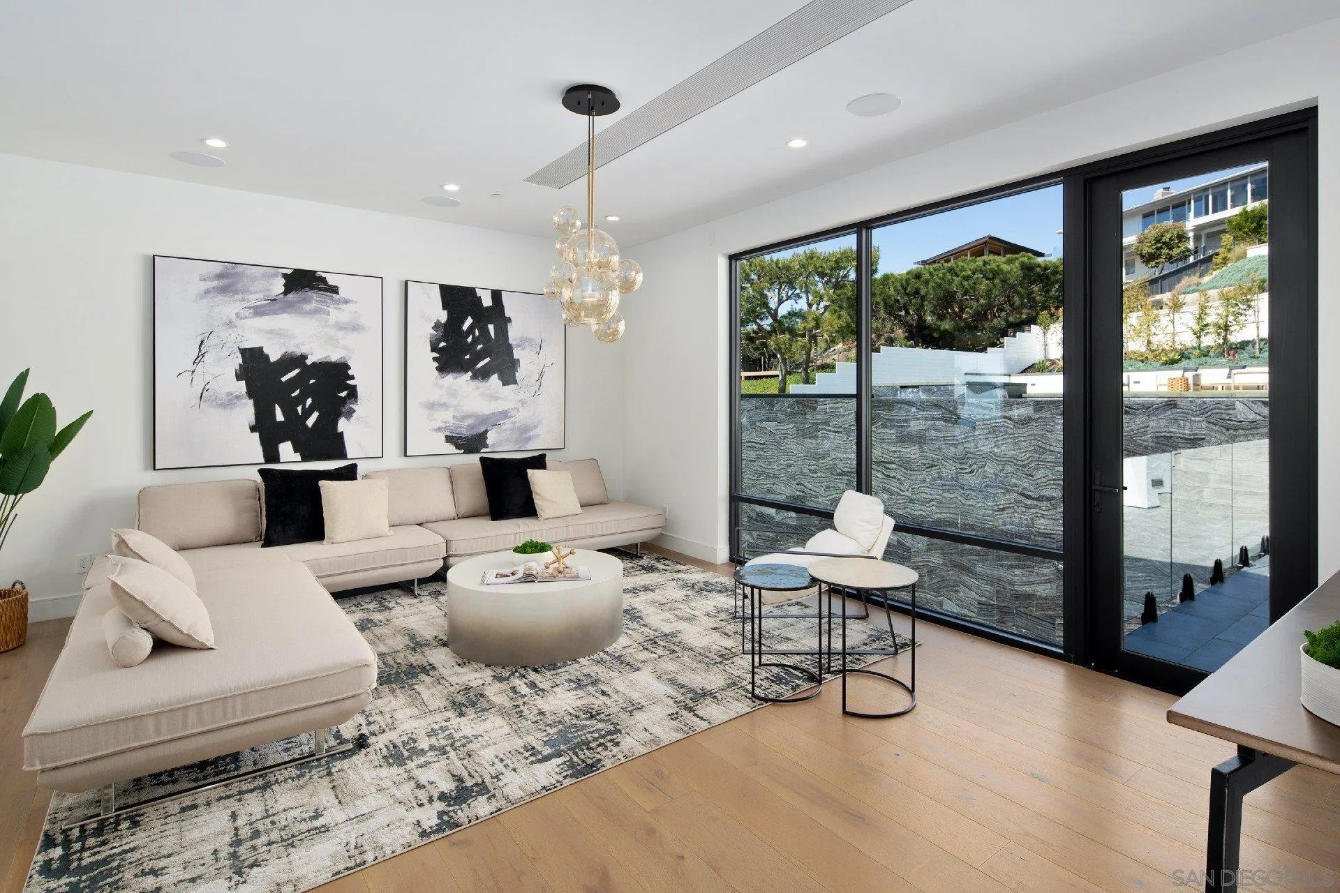 926 La Jolla Rancho Road La Jolla, CA 92037 - Photo 31 of 54 a living room with furniture and a large window