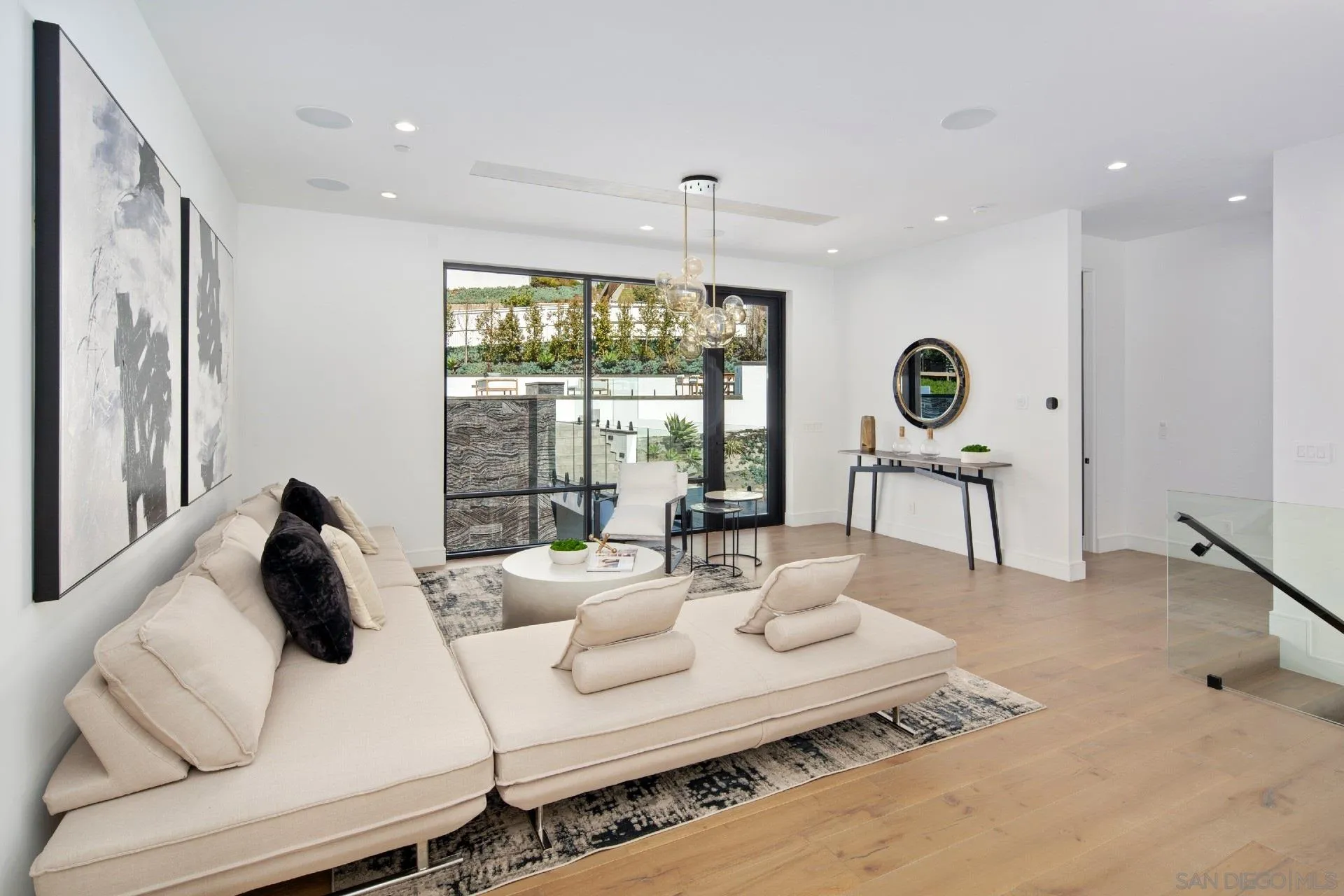 926 La Jolla Rancho Road La Jolla, CA 92037 - Photo 32 of 54 a living room with furniture and a large window