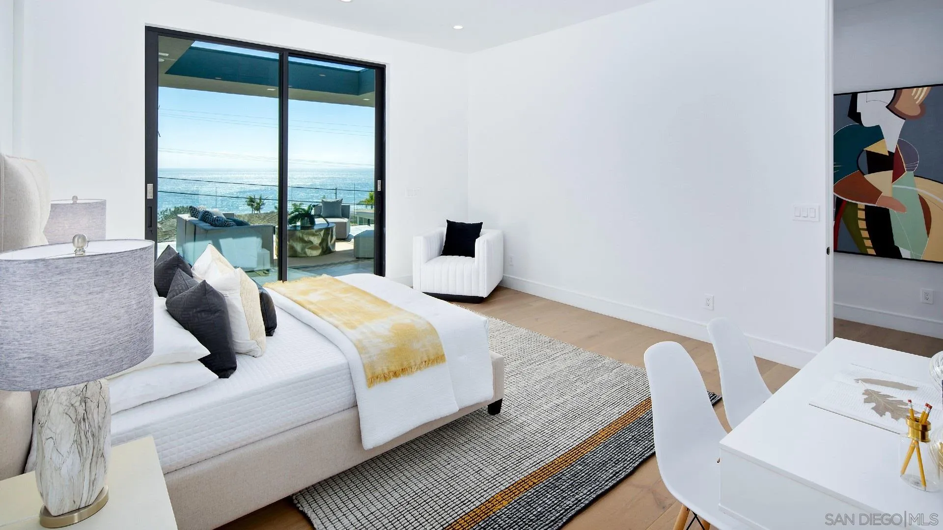 926 La Jolla Rancho Road La Jolla, CA 92037 - Photo 35 of 54 a bedroom with a bed and large window