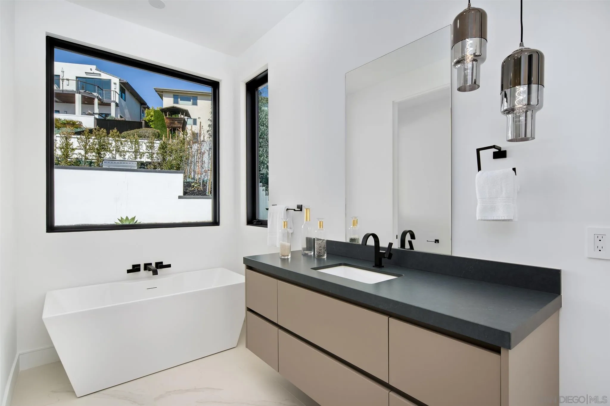 926 La Jolla Rancho Road La Jolla, CA 92037 - Photo 36 of 54 a bathroom with a sink and a mirror