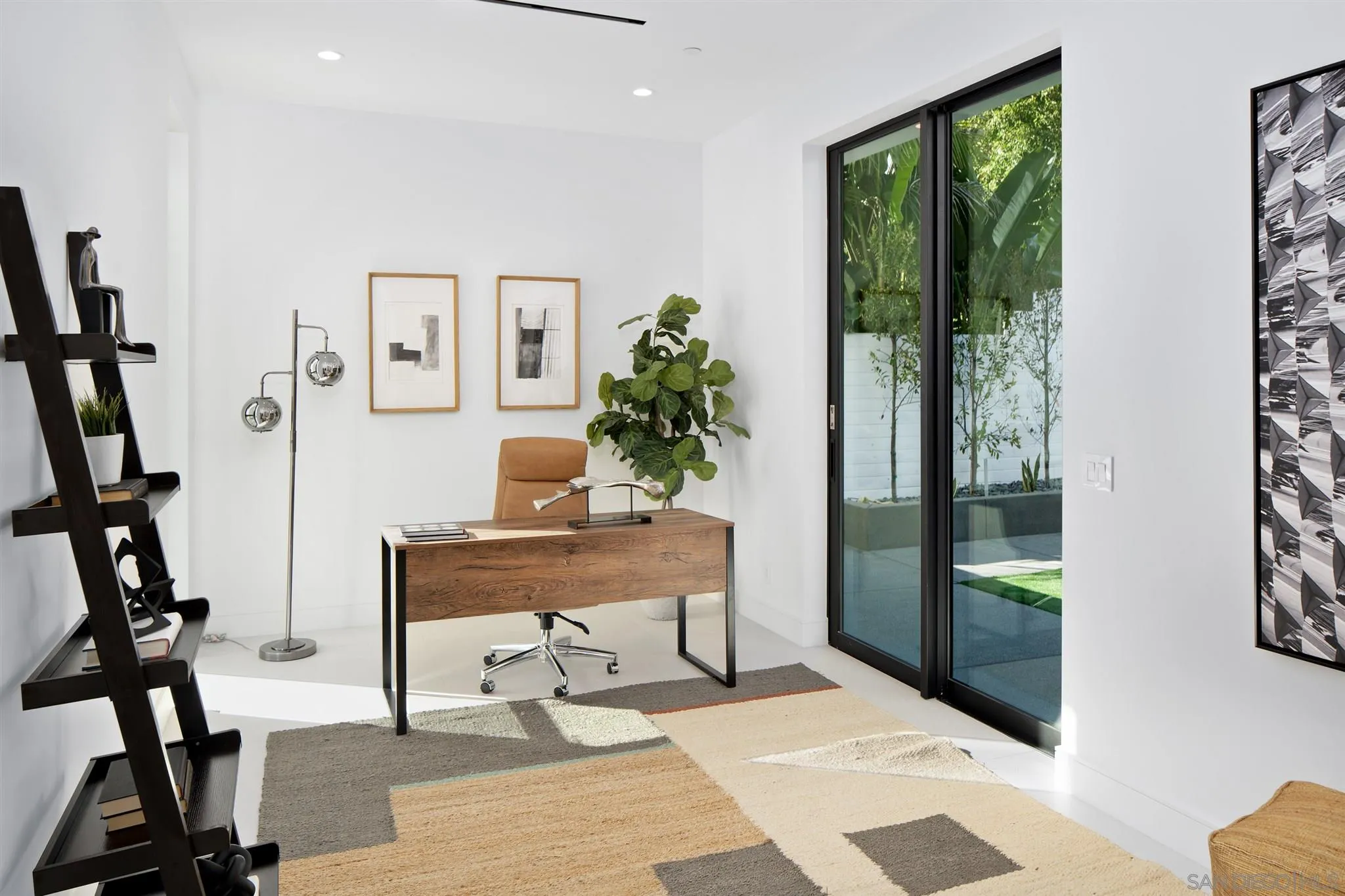 926 La Jolla Rancho Road La Jolla, CA 92037 - Photo 40 of 54 a view of a workspace with furniture and a window