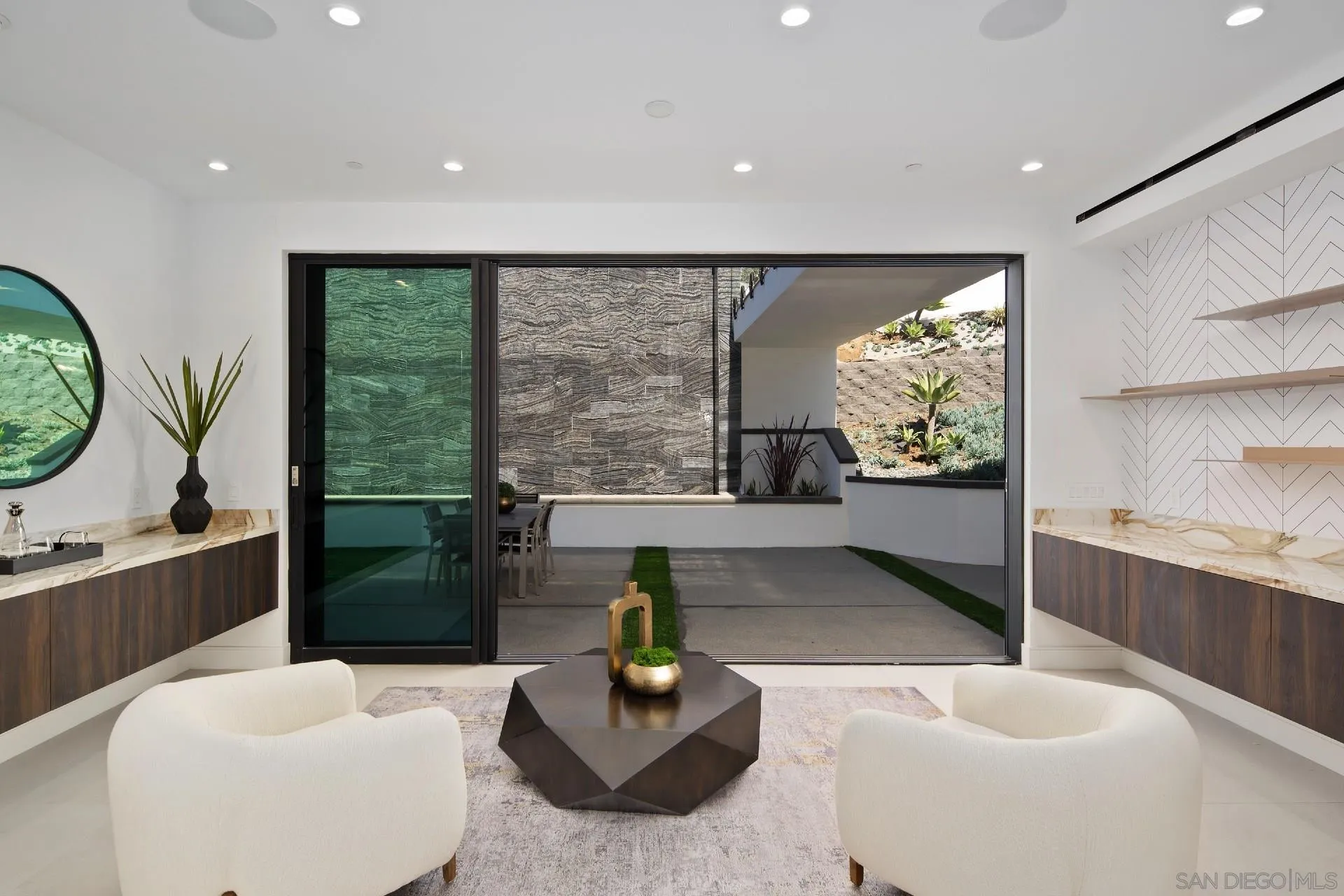926 La Jolla Rancho Road La Jolla, CA 92037 - Photo 43 of 54 a living room with furniture and a large window