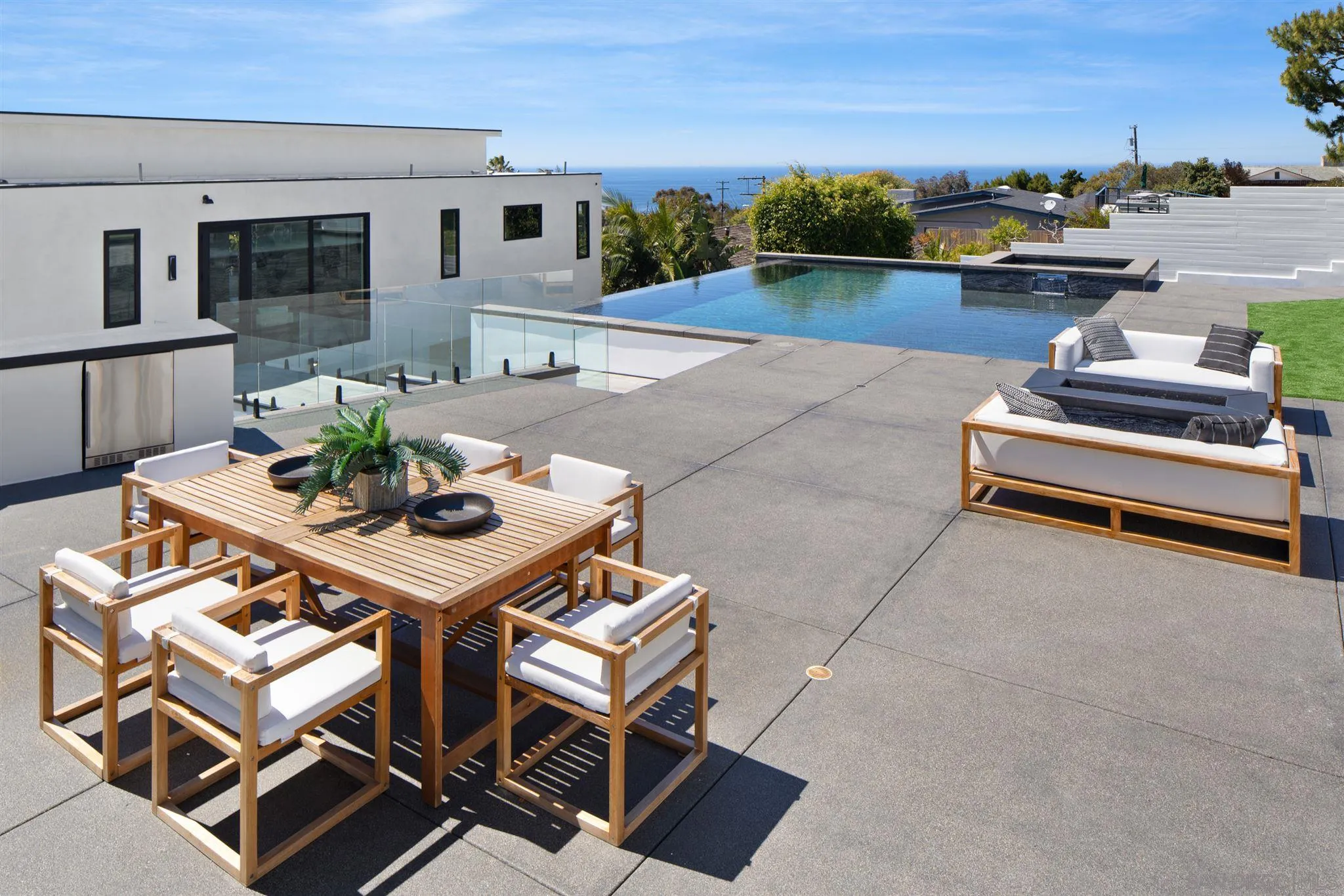 926 La Jolla Rancho Road La Jolla, CA 92037 - Photo 9 of 54 a view of a patio with table and chairs and potted plants