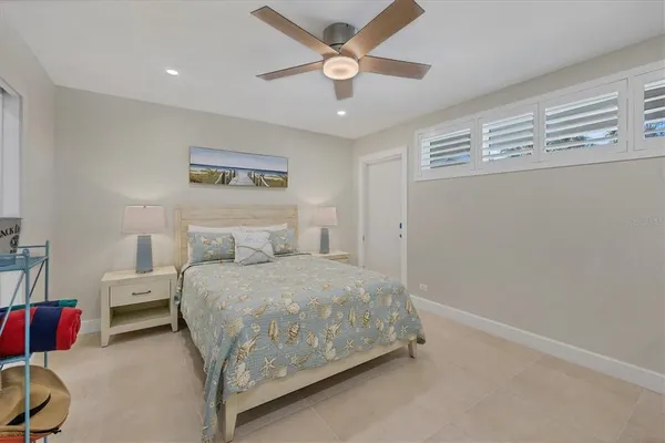 a bedroom with a bed and a lamp