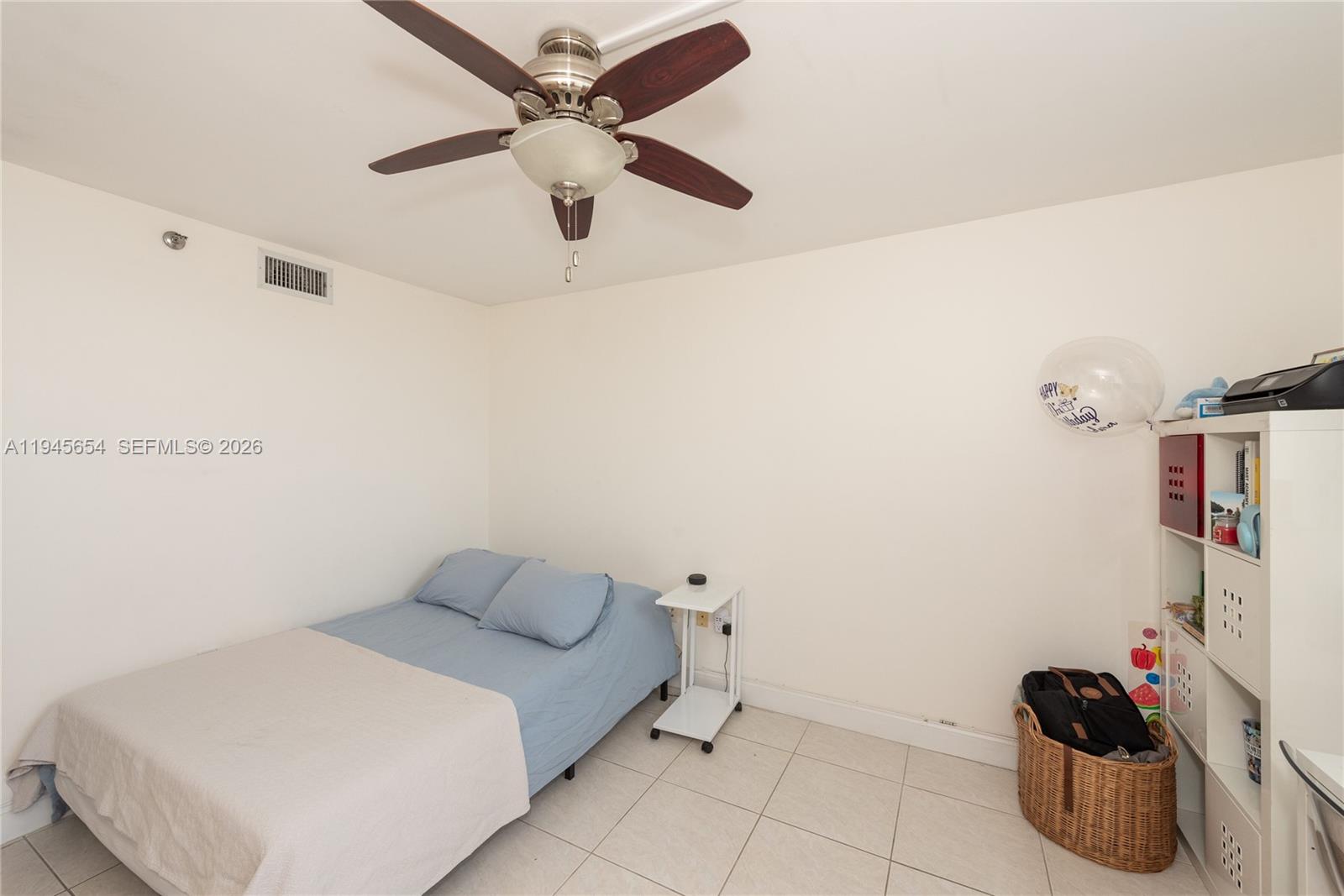 2400 Southwest 3rd Avenue, Unit 703 Miami, FL 33129 - Photo 16 of 29 a bedroom with a bed and ceiling fan
