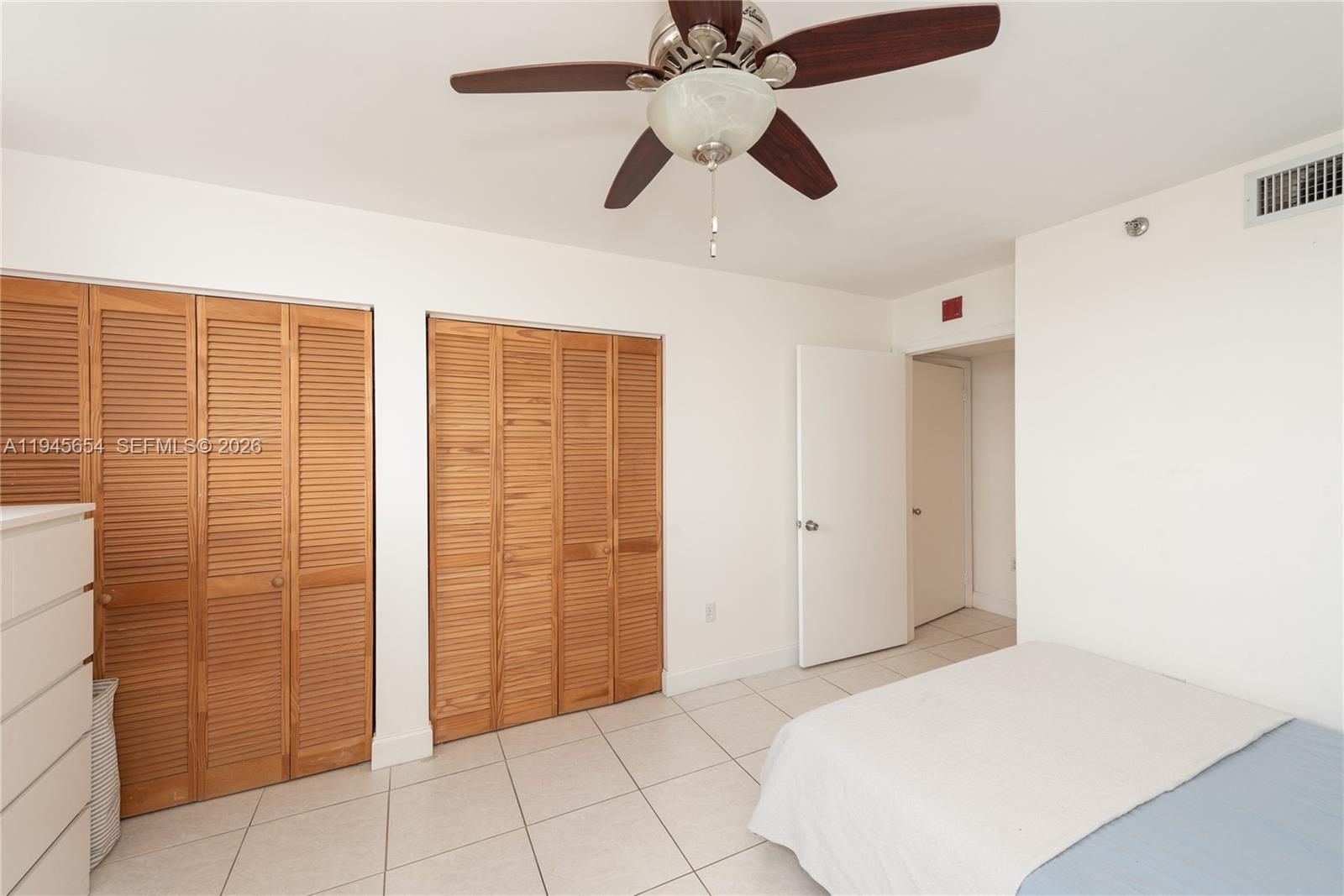 2400 Southwest 3rd Avenue, Unit 703 Miami, FL 33129 - Photo 17 of 29 a bedroom with a bed and a shower
