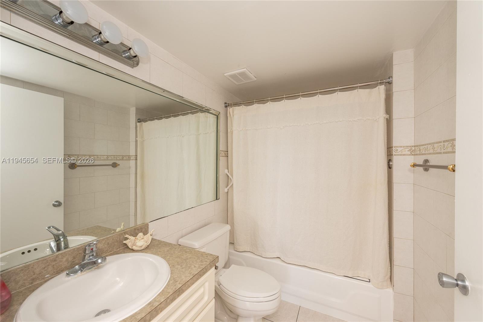 2400 Southwest 3rd Avenue, Unit 703 Miami, FL 33129 - Photo 18 of 29 a bathroom with a sink toilet and shower