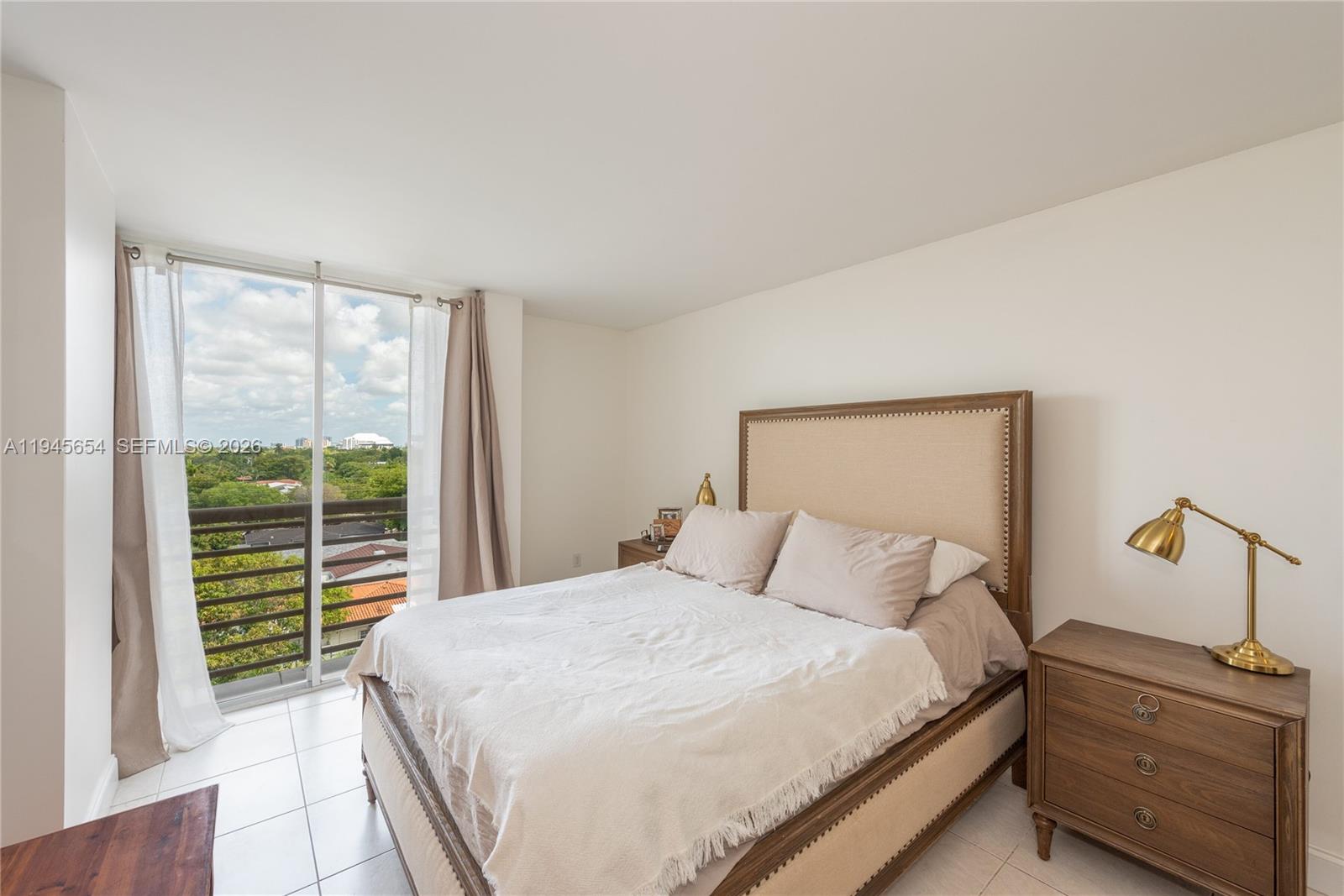 2400 Southwest 3rd Avenue, Unit 703 Miami, FL 33129 - Photo 19 of 29 a bedroom with a bed and a window