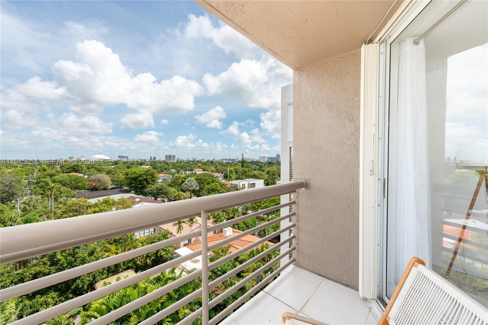 2400 Southwest 3rd Avenue, Unit 703 Miami, FL 33129 - Photo 2 of 29 a view of a balcony with wooden floor and wooden fence