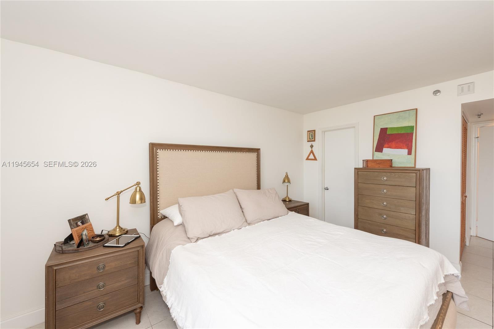 2400 Southwest 3rd Avenue, Unit 703 Miami, FL 33129 - Photo 21 of 29 a bedroom with a bed and dresser