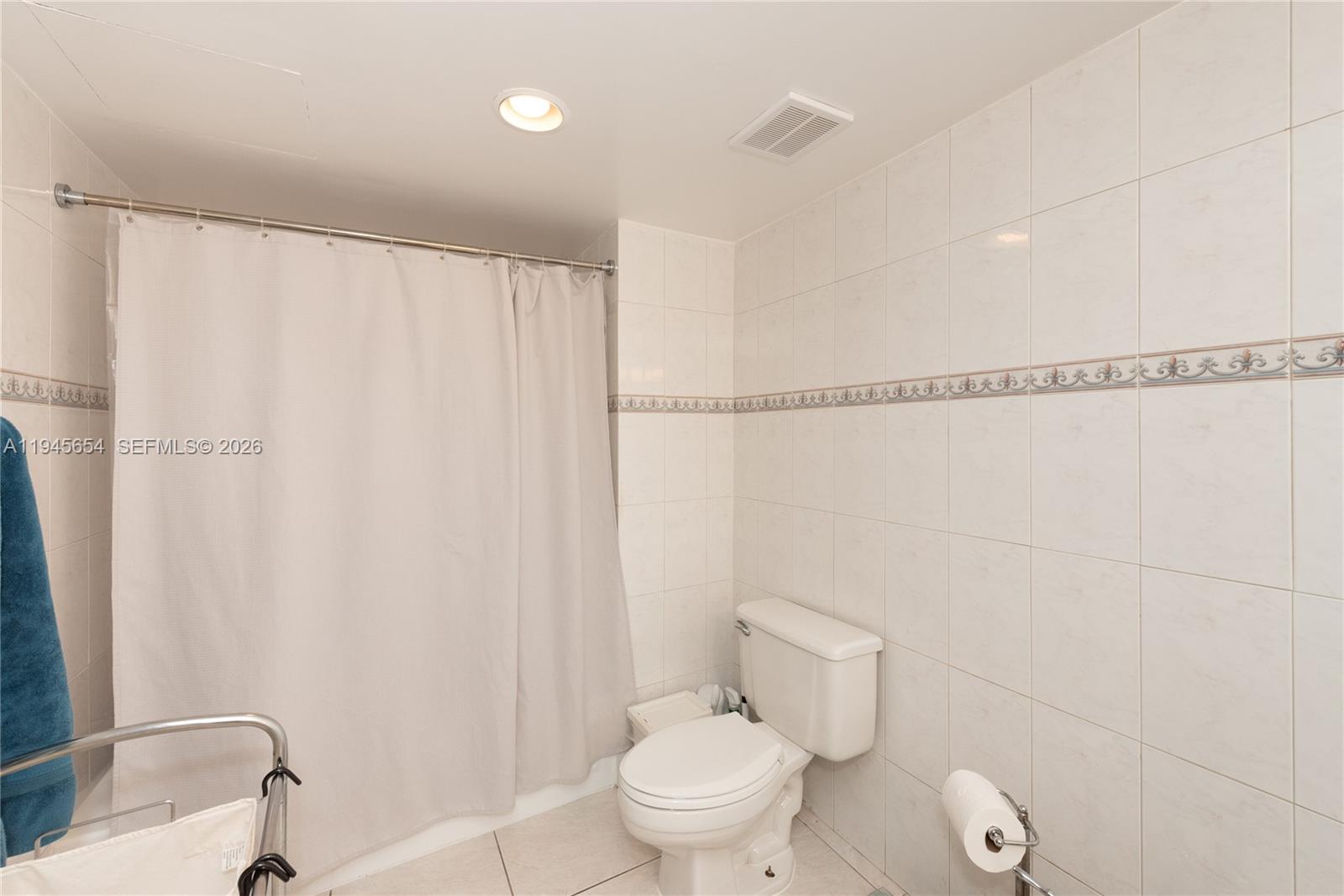 2400 Southwest 3rd Avenue, Unit 703 Miami, FL 33129 - Photo 24 of 29 a bathroom with a sink and a toilet