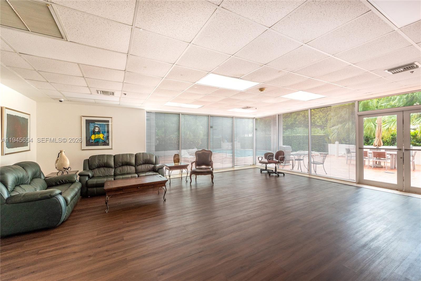 2400 Southwest 3rd Avenue, Unit 703 Miami, FL 33129 - Photo 26 of 29 a living room with furniture and a wooden floor