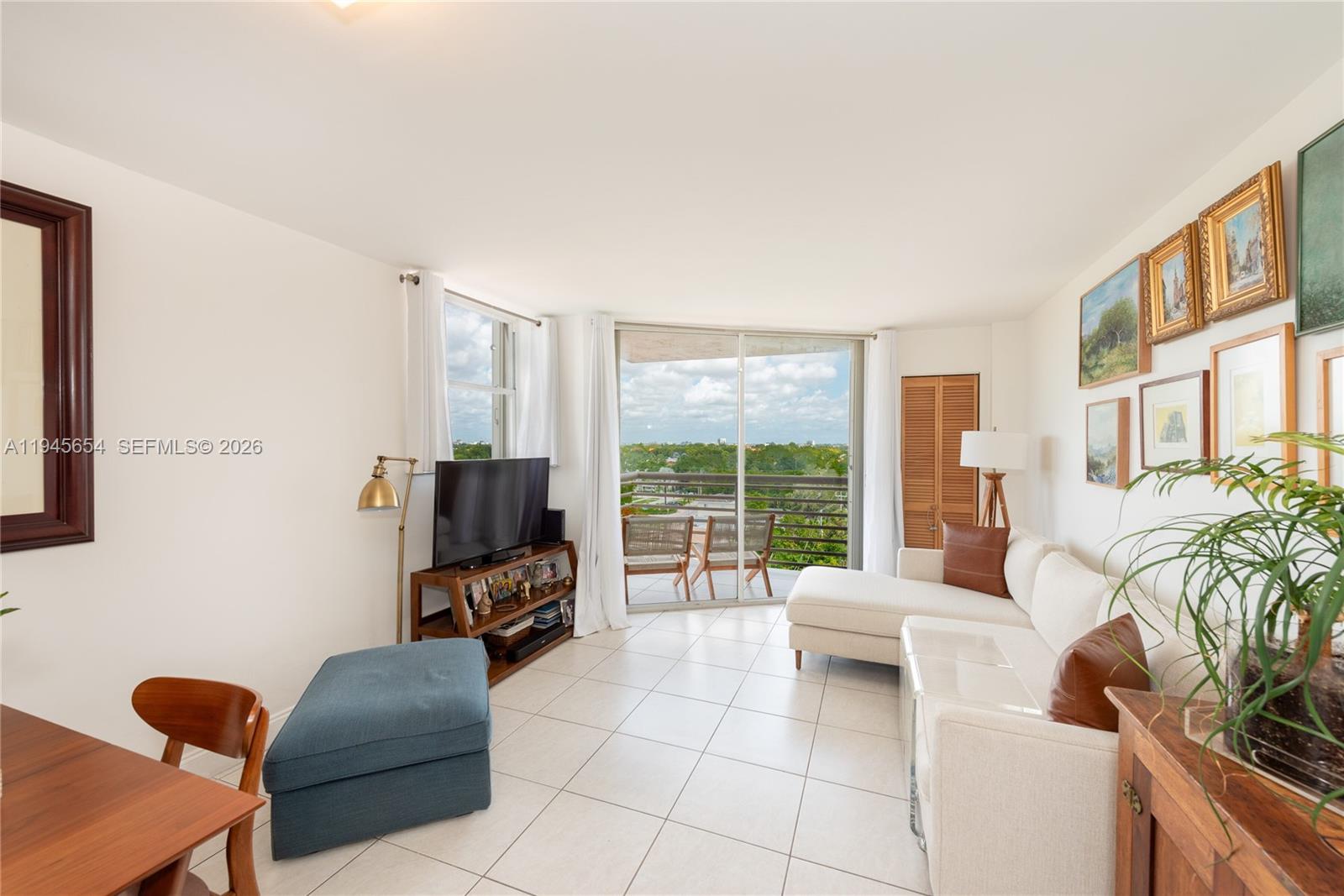 2400 Southwest 3rd Avenue, Unit 703 Miami, FL 33129 - Photo 3 of 29 a living room with furniture and a large window