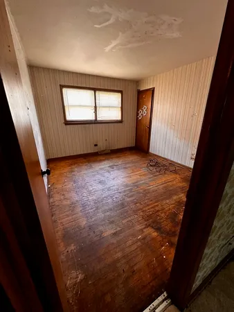 a room with bed and window