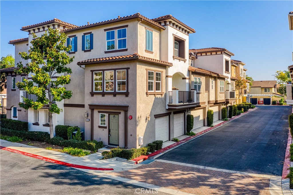 a front view of a residential apartment building with a yard