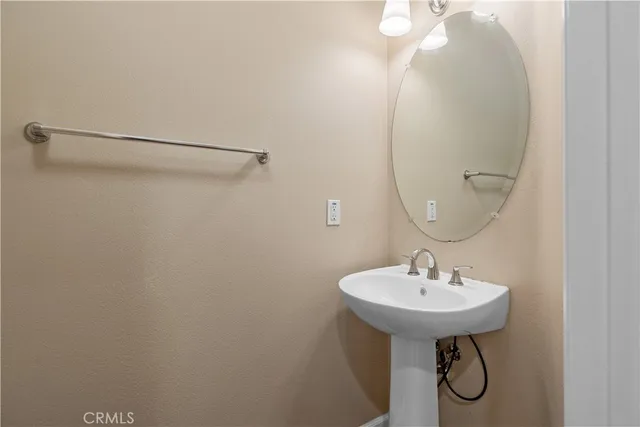 a bathroom with a sink and mirror