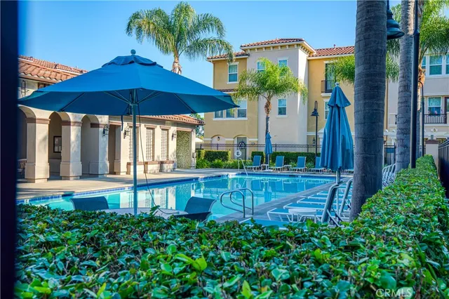 a view of a house with a yard and sitting area
