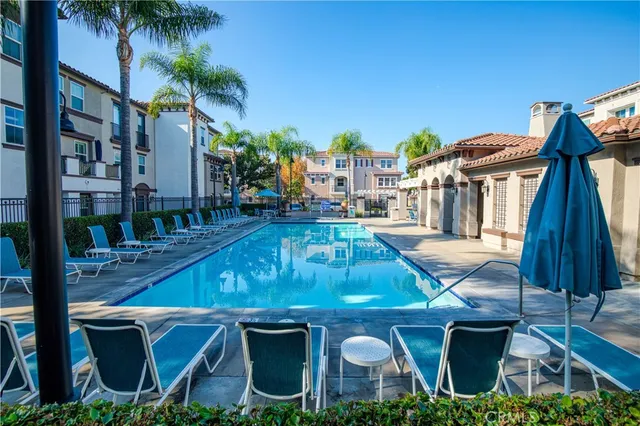 a view of a backyard with swimming pool