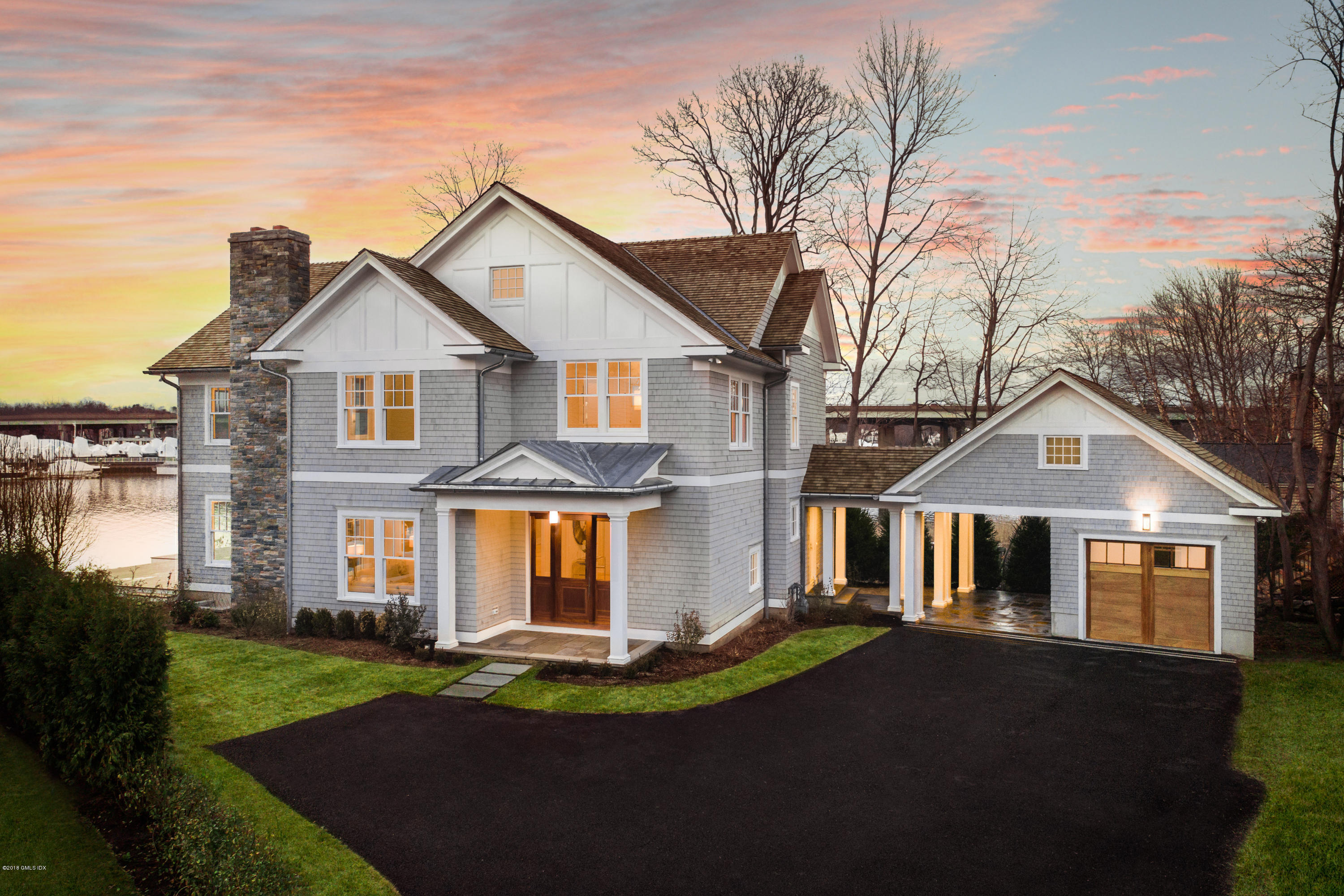 27 Bayside Terrace Riverside, CT 06878 - Photo 3 of 56 front view of a house with a yard