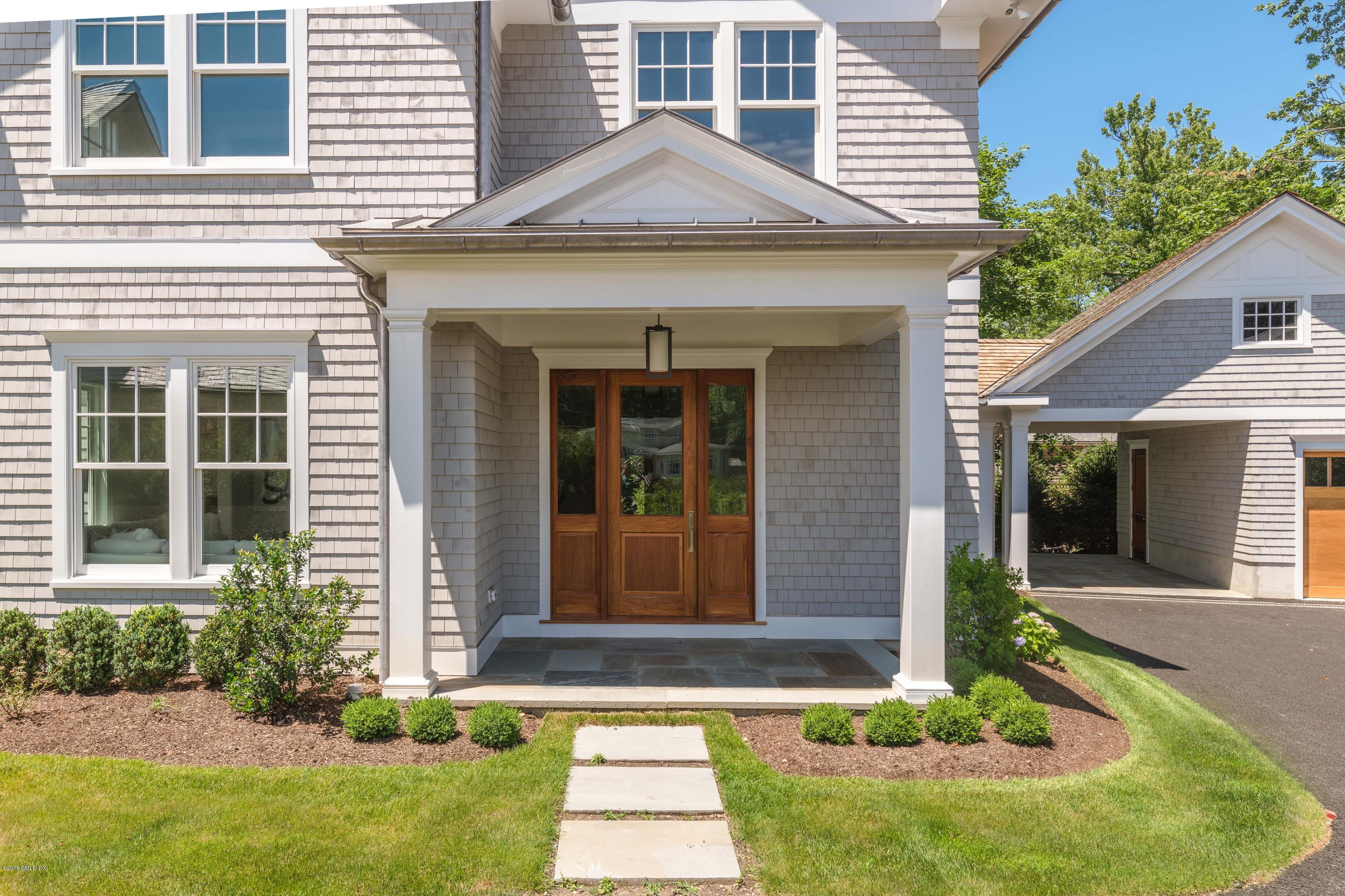 27 Bayside Terrace Riverside, CT 06878 - Photo 4 of 56 front view of a house with a yard
