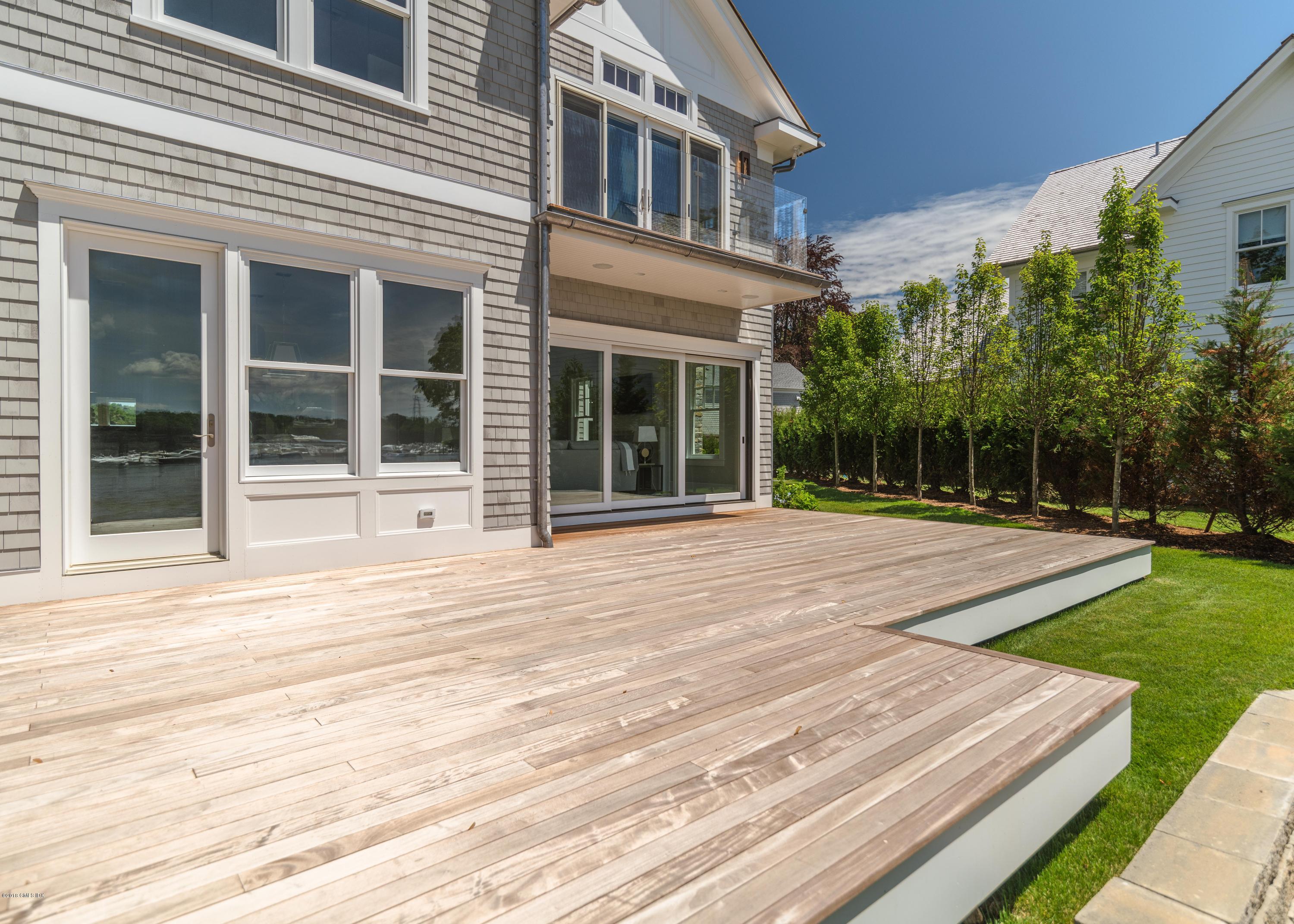 27 Bayside Terrace Riverside, CT 06878 - Photo 54 of 56 front view of a house with a yard