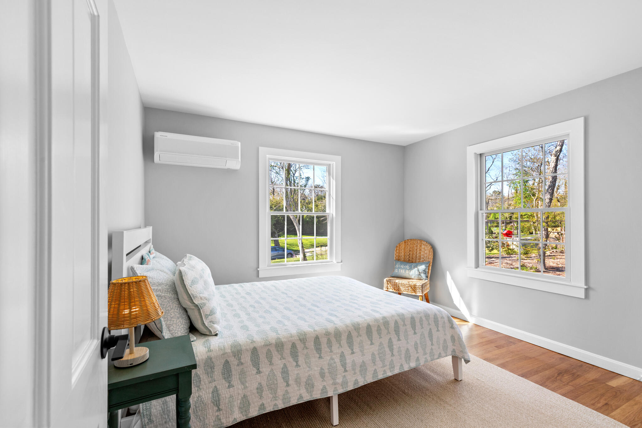 1295 Massasoit Road Eastham, MA 02642 - Photo 19 of 32 a bedroom with a bed and wooden floor