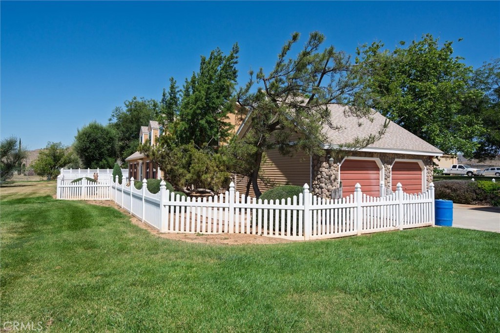 34150 Stowe Road Winchester, CA 92545 - Photo 69 of 80 a view of a house with a small yard and a garden
